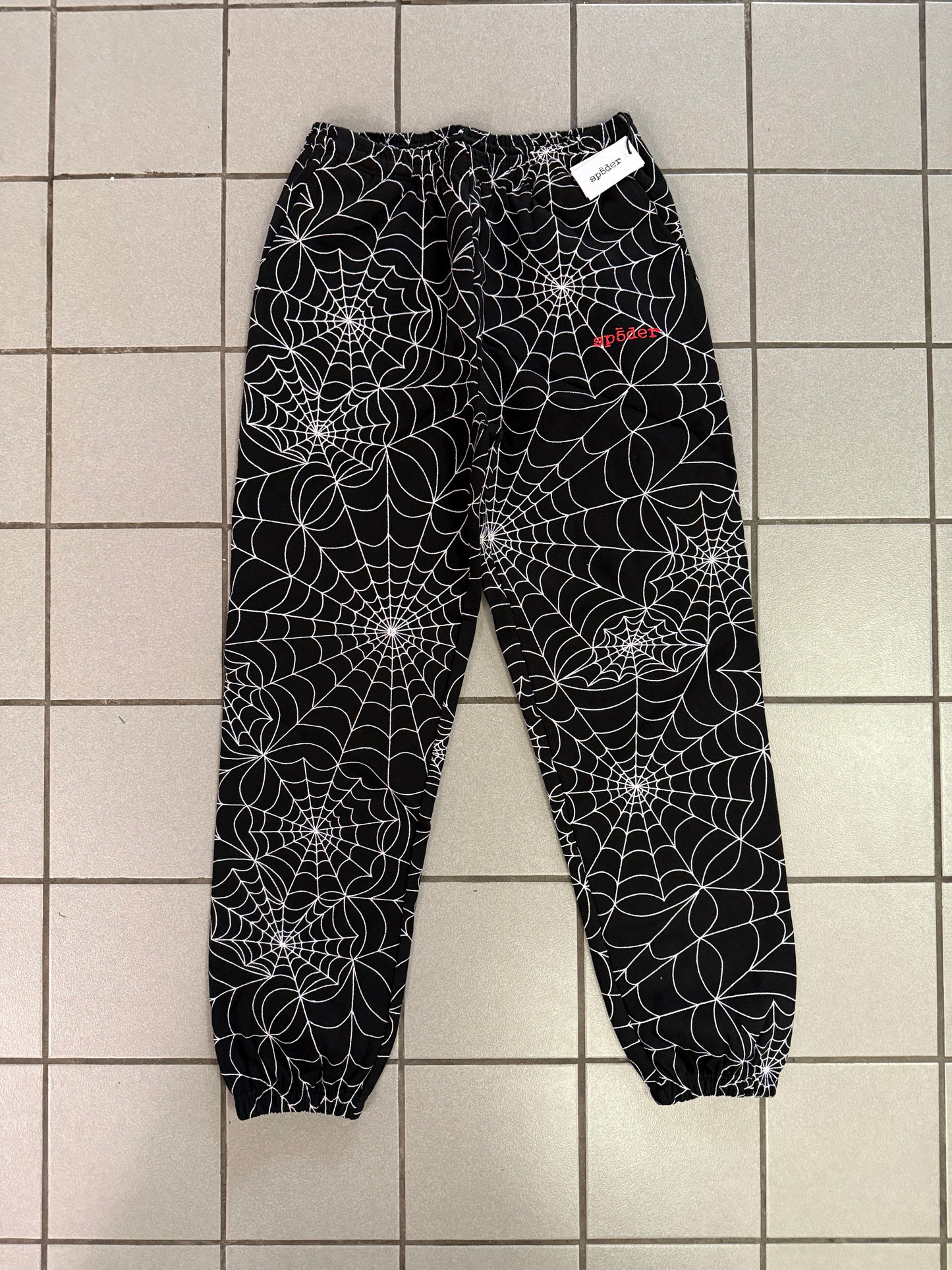SP5DER “Embroidered Web” AOP Sweatpants