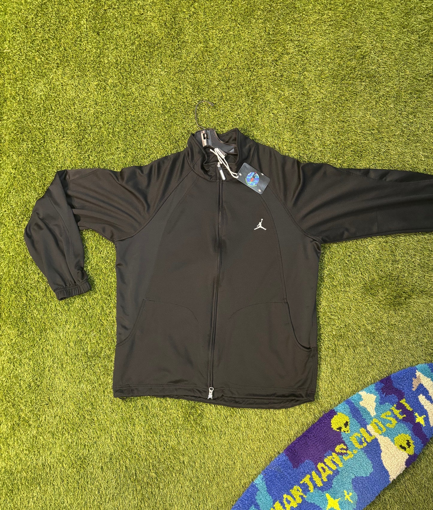 All black Jordan zip up .