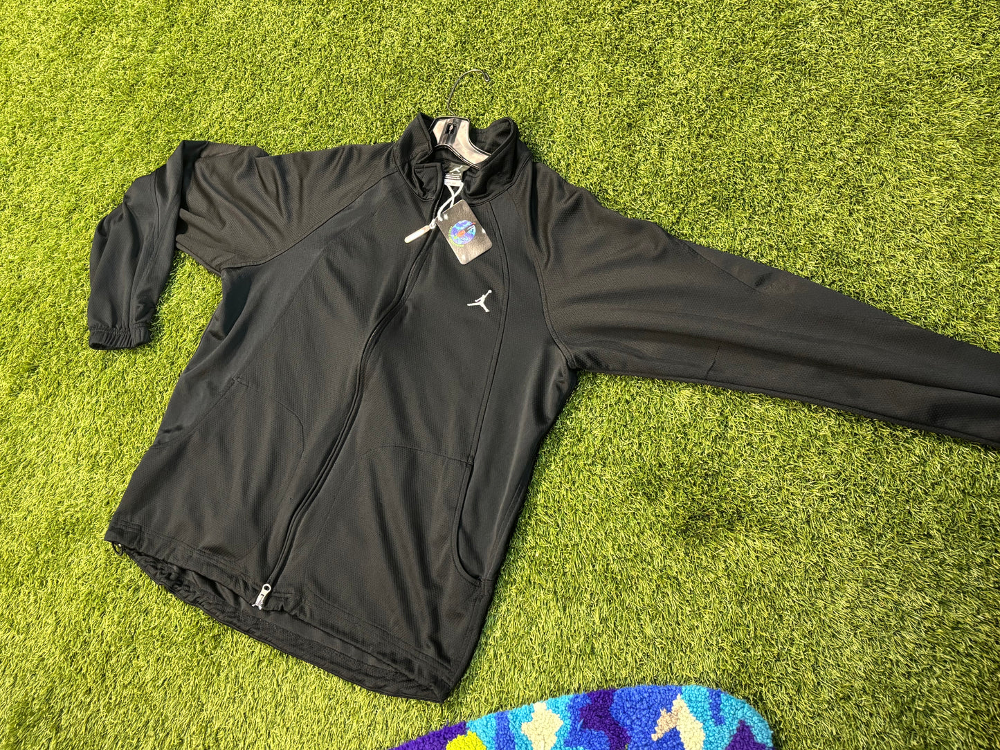 All black Jordan zip up .