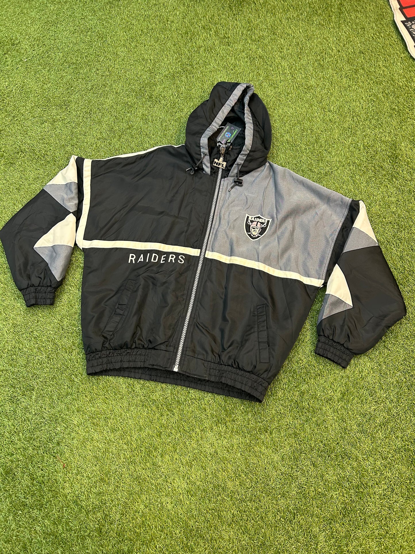 Vintage 90s Pro Player NFL  Oakland Raiders Puffer Jacket