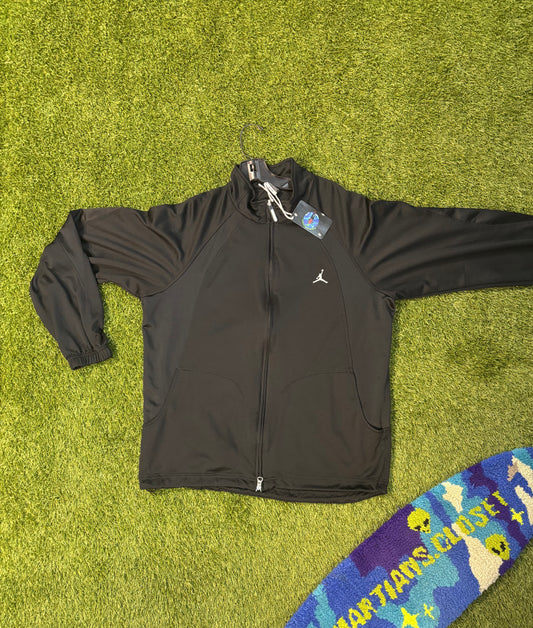 All black Jordan zip up .