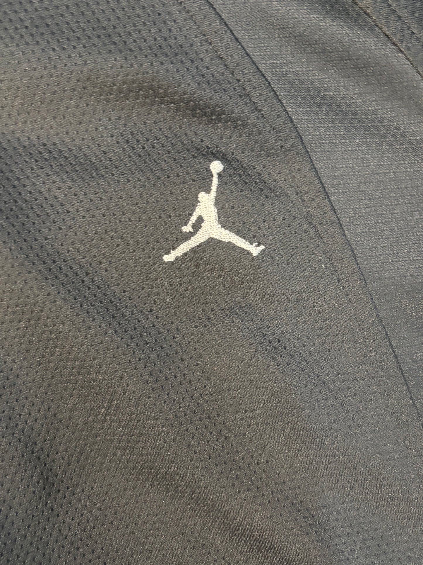 All black Jordan zip up .